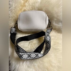 ah . dorned White Crossbody Bag with Patterned Strap